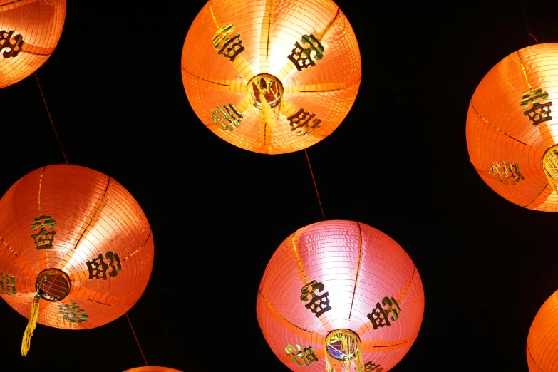 oriental style lanterns with asian decorations on them