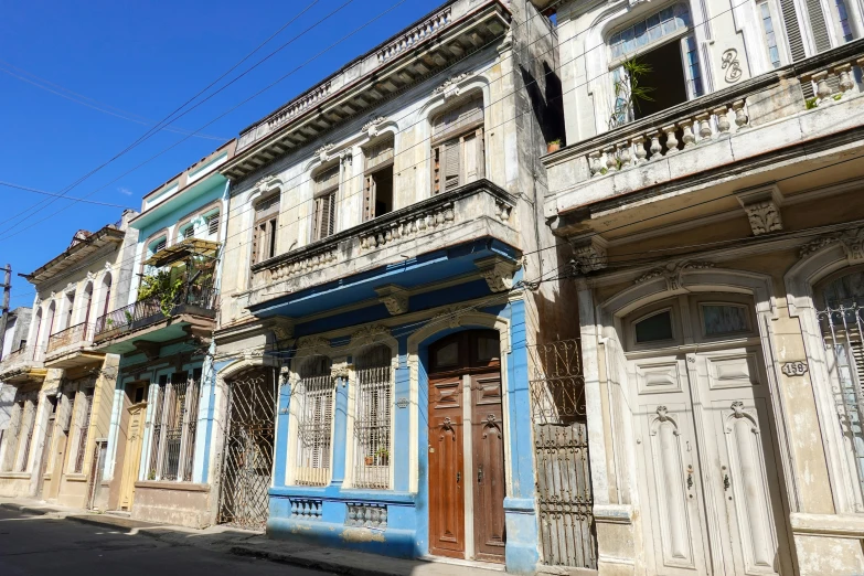 many old style buildings are painted blue and white