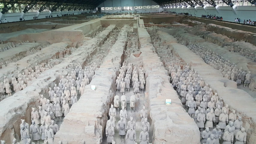 a large long row of rows of sand statues