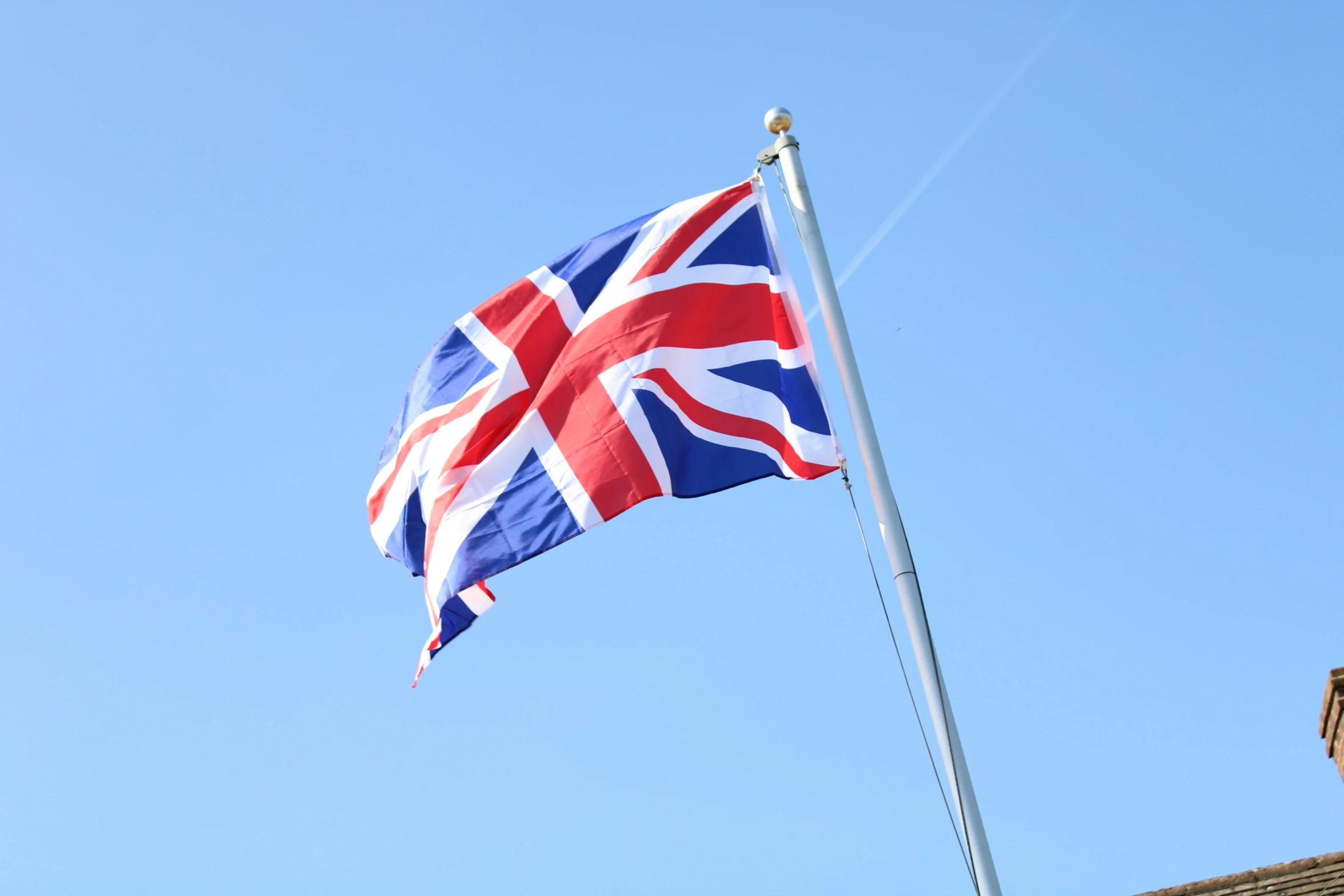 a flag flying on a pole in the air