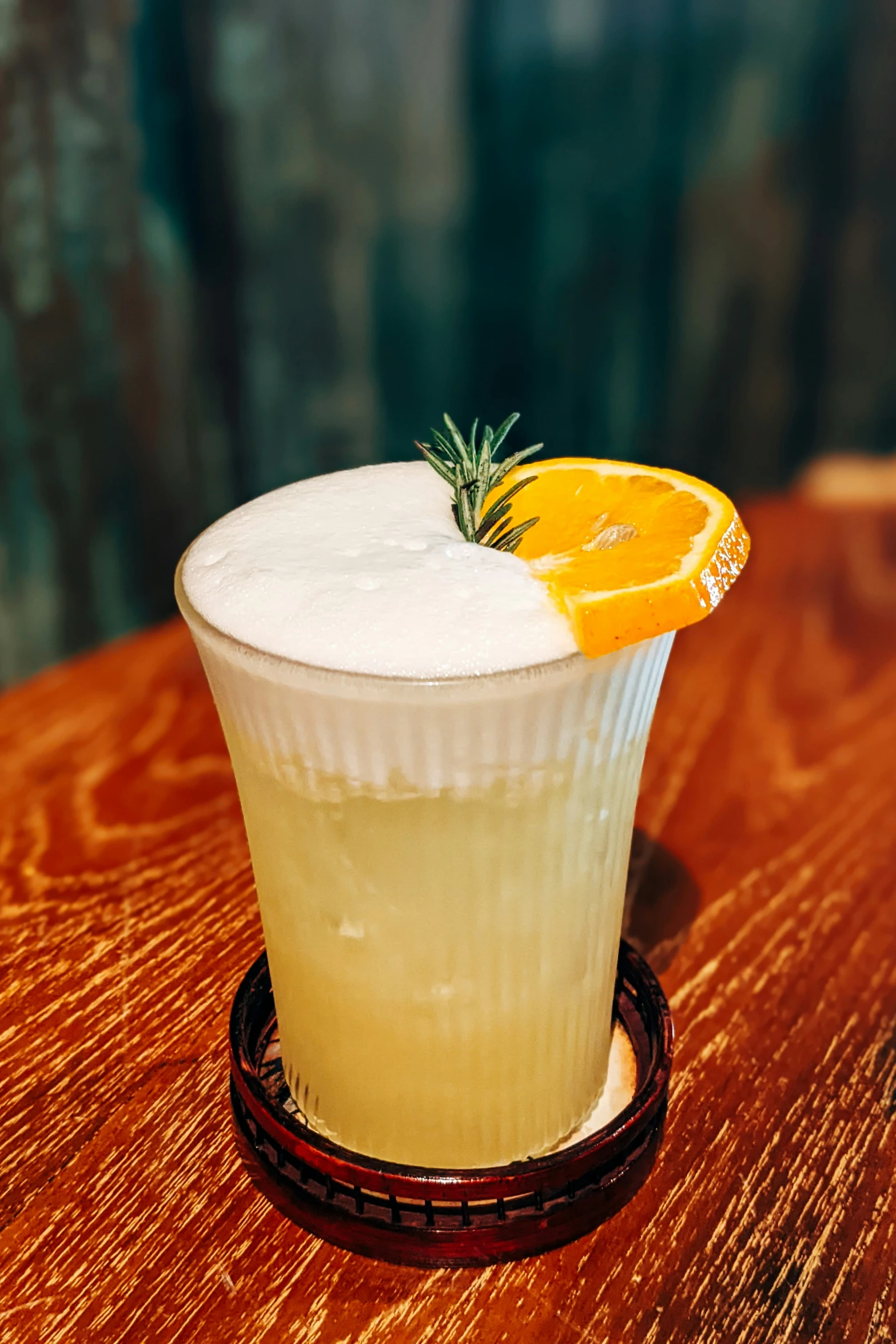 a drink sitting on top of a wooden table