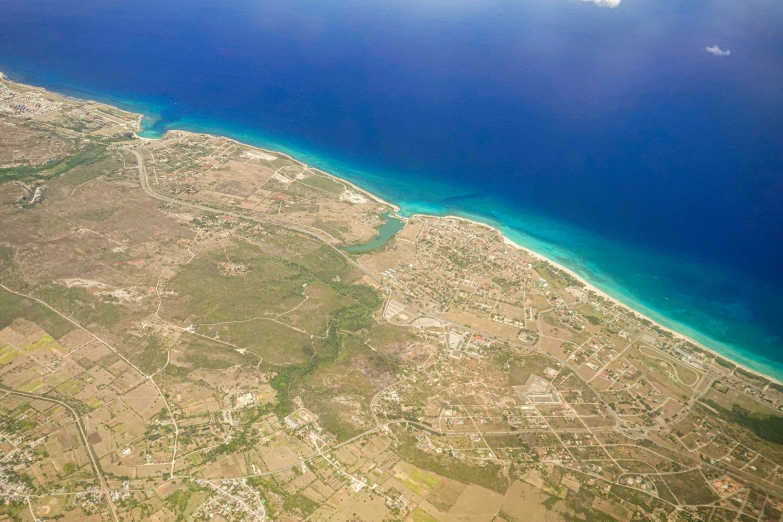 the aerial view shows the ocean and land below