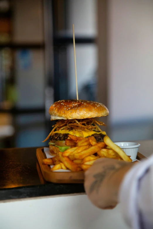 a hamburger with french fries in a restaurant