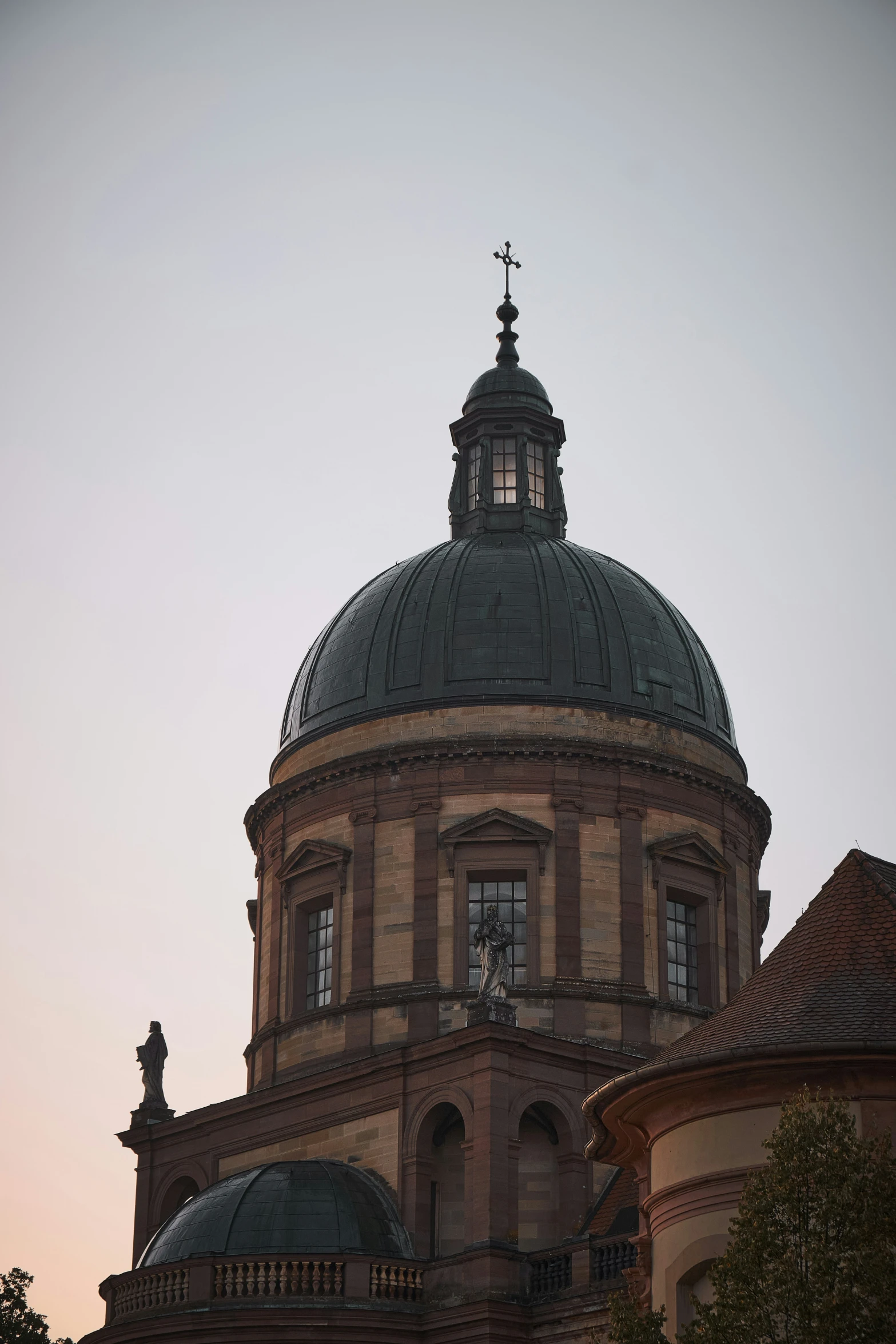 a clock is on top of the dome of a building