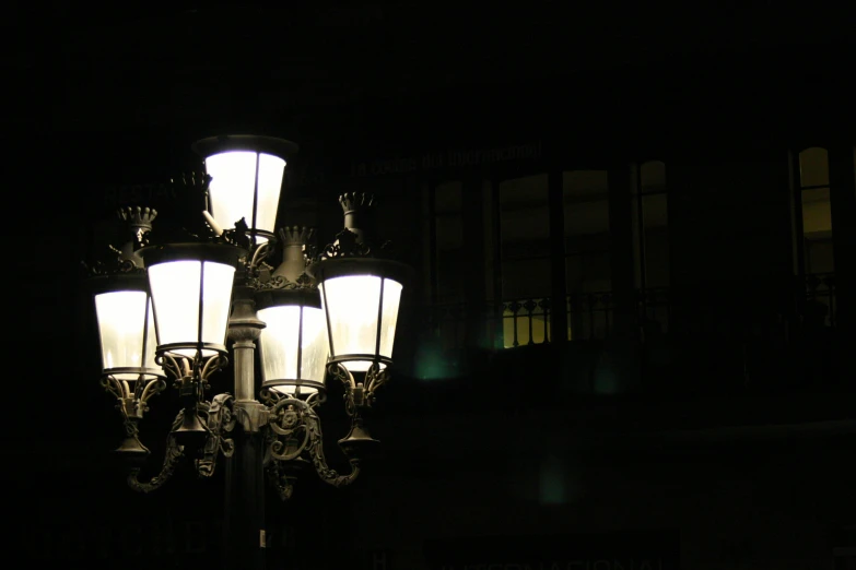 the lamp post is illuminated by many different lamps