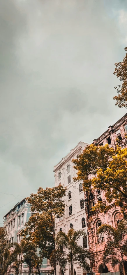 a street is lined with a white building