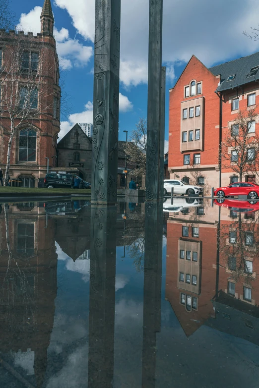 an old building with a clock tower in the reflection