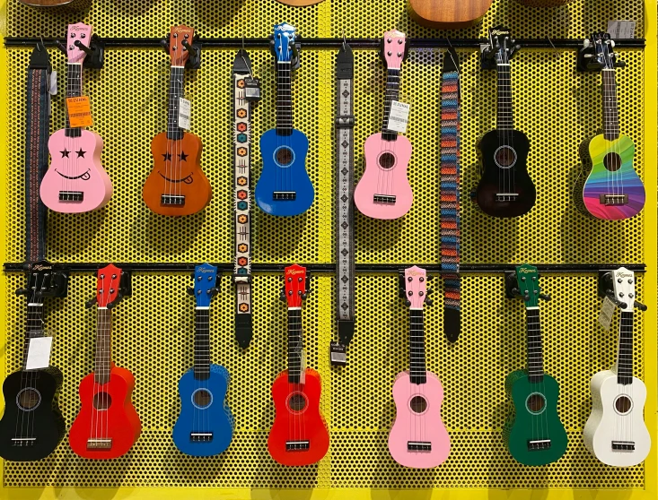 guitars hang on a shelf with strings of music