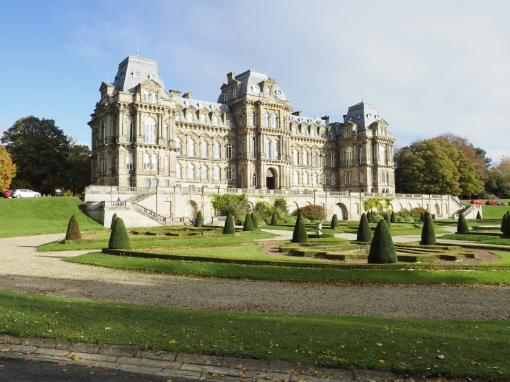 a very large castle building with a lot of gardens