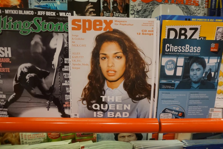 a shelf is filled with magazines with covers