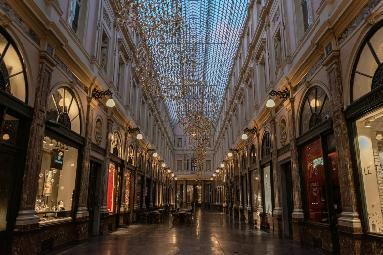 a large building has fancy glass ceiling lights