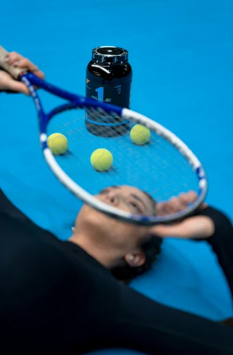 a person with a tennis racket about to hit a ball