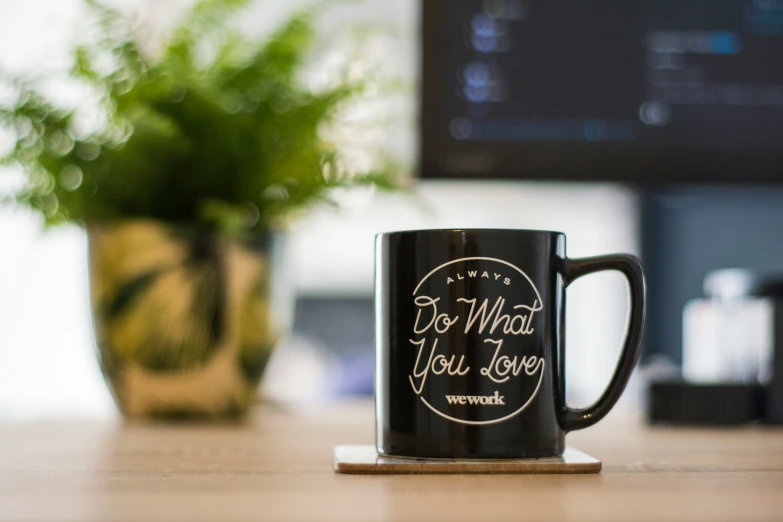 a black mug on top of a table