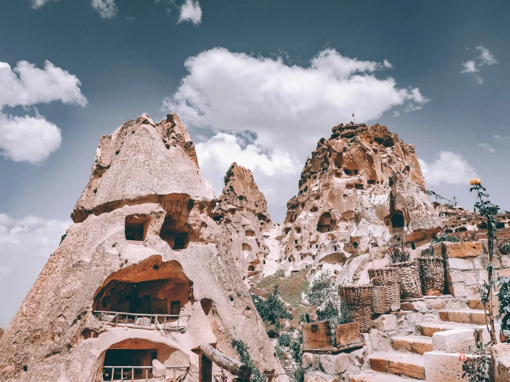 an old rock building made of rocks with some stairs leading to it