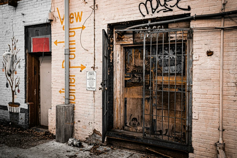 a wall with graffiti on it next to a door