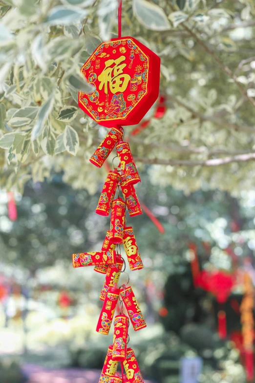 red paper decorations hanging from the tree