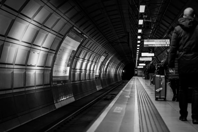 a black and white po of a train station