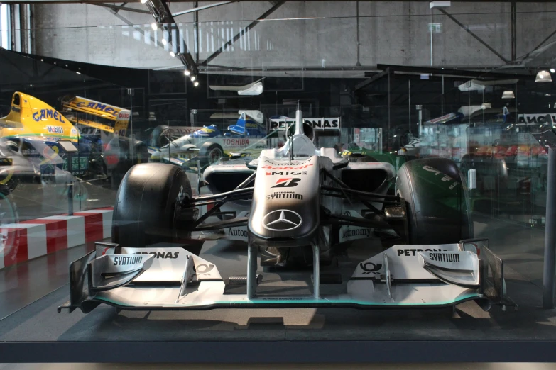 a formula race car in a museum display case