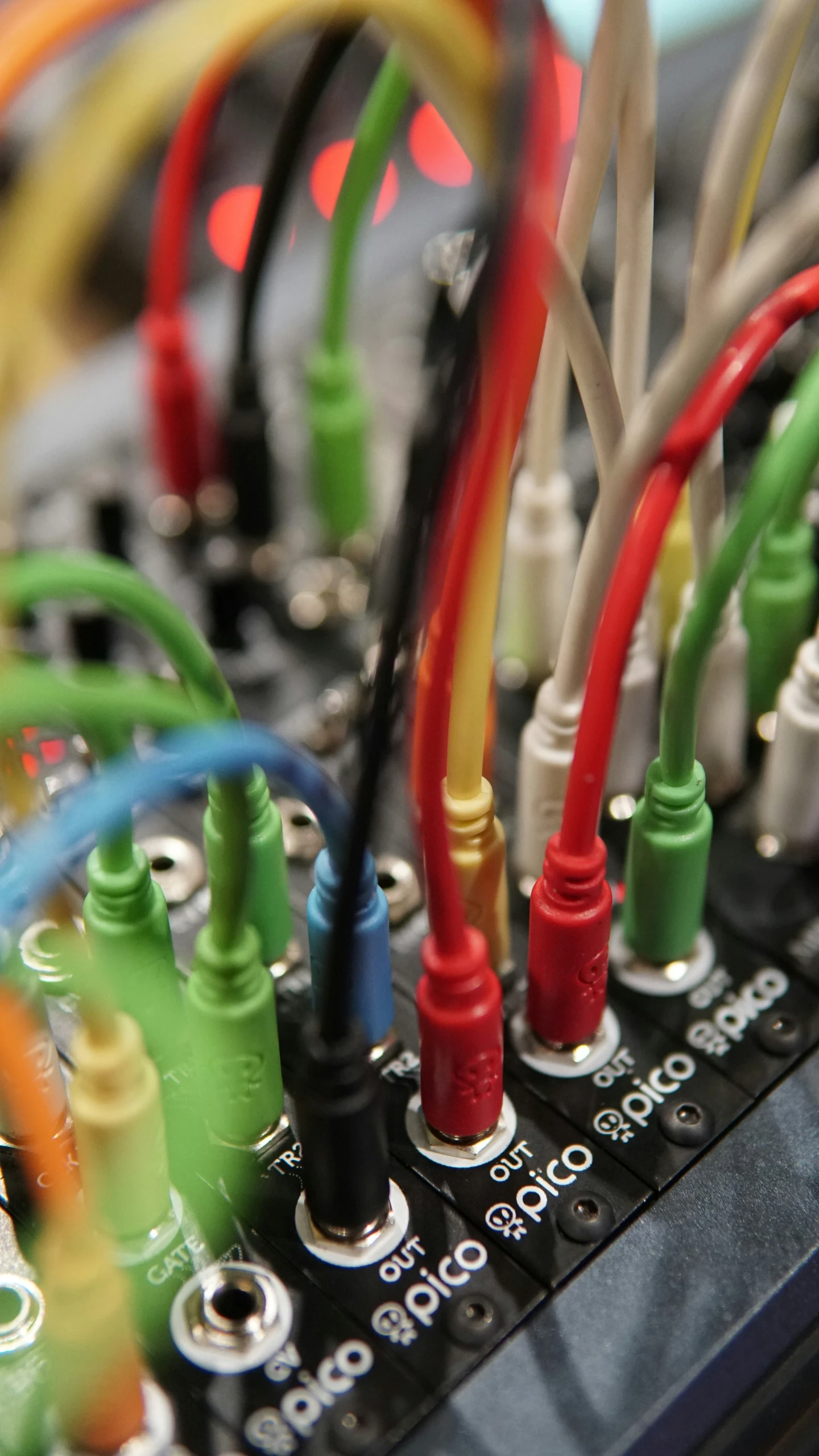 a close up of a computer board showing cables and wires