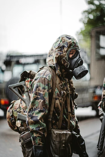 the man is in camouflage gear and wearing a helmet