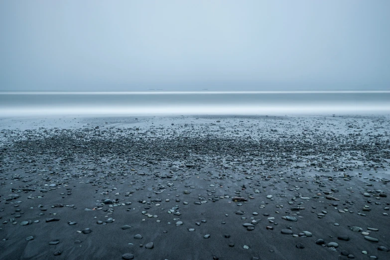 some black stones water sky and clouds