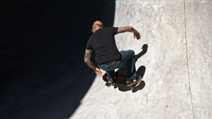 a man rides his skateboard down a ramp