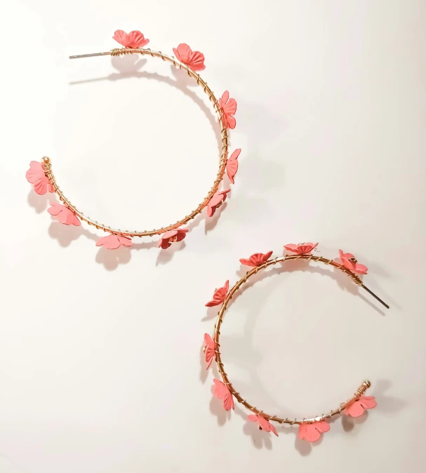 two circular hoops with pink flowers and beads