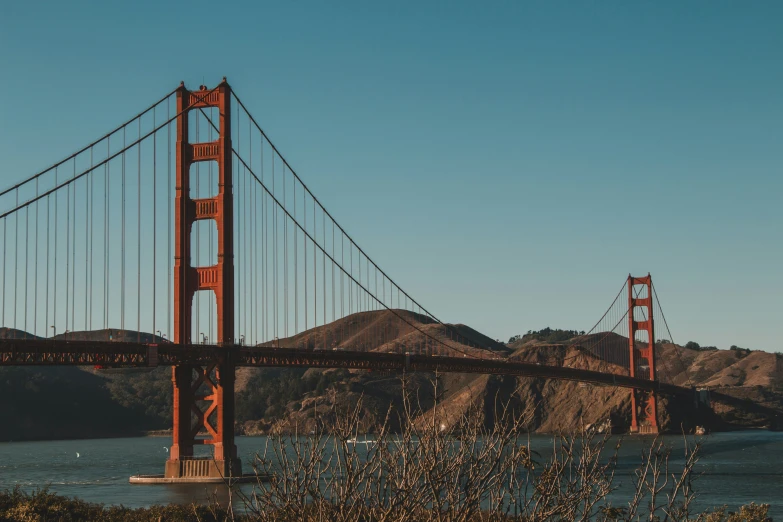 a large suspension bridge spanning over a body of water