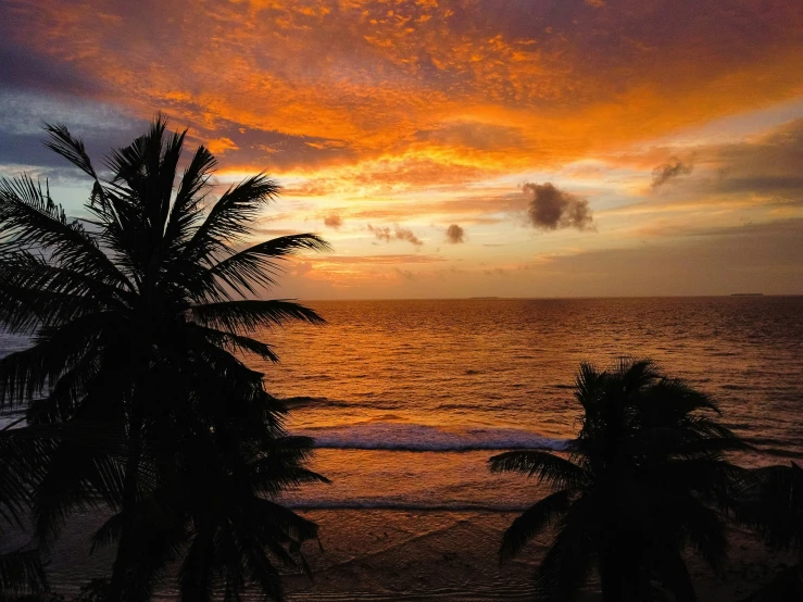 an image of sunset that is being viewed from a balcony