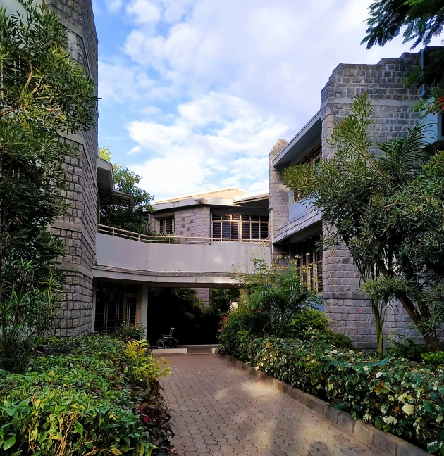 a large courtyard surrounded by greenery and trees