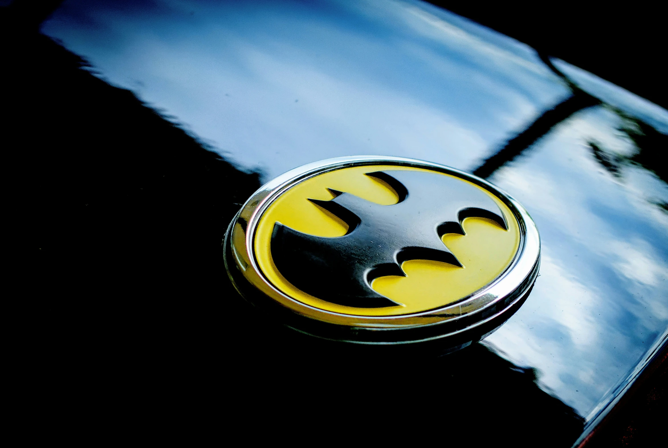 the emblem of a batman vehicle that is on the hood