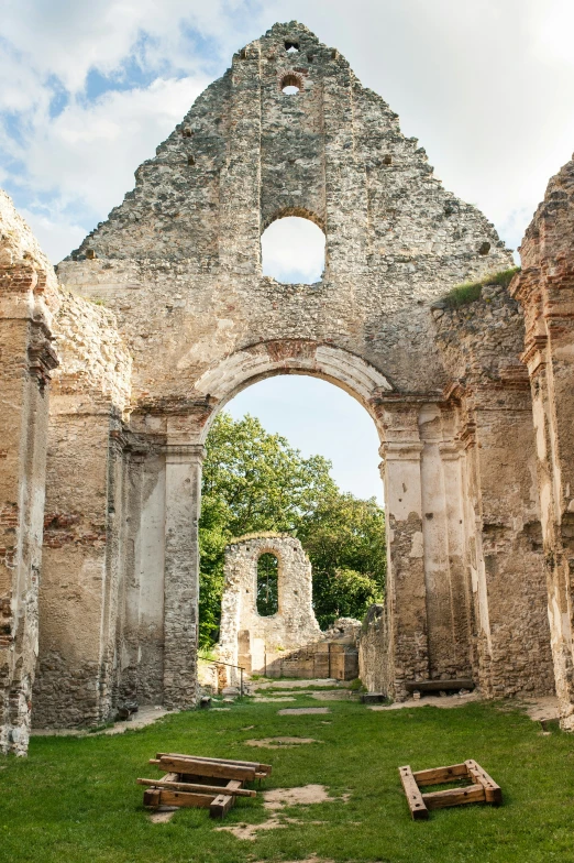 an archway leading into an old church made of stone and brick