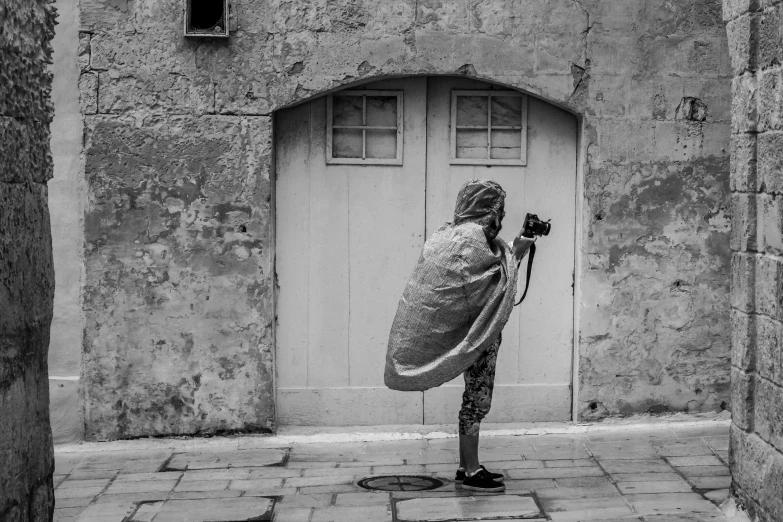 a woman in an image has her arms wrapped around the door