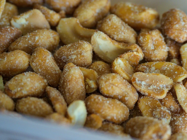 a bunch of doughnuts covered in sugar