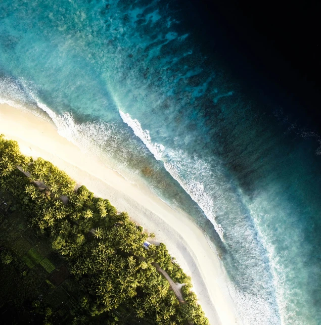 a small island surrounded by blue water and green vegetation