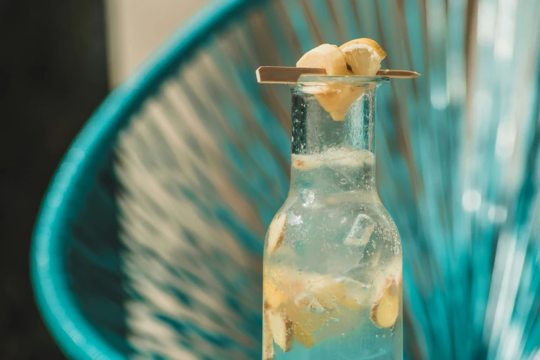 a bottle filled with liquid next to a basket