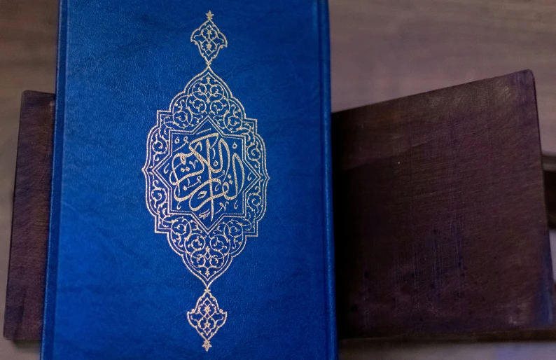 a book sitting next to a wooden box