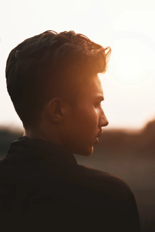 a man with dark hair wearing a jacket