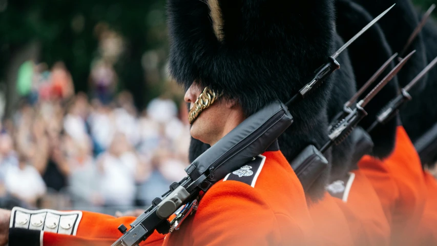 an orange uniformed person in the military band