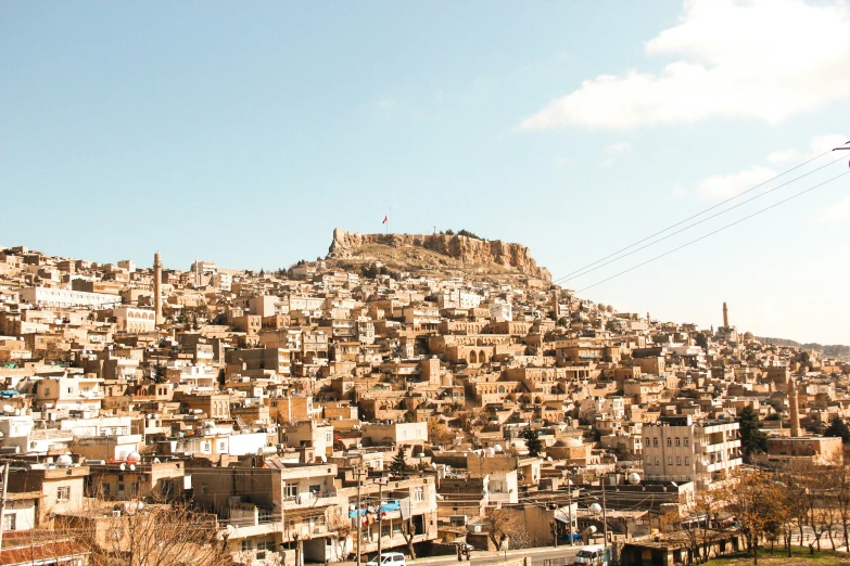 there is a large group of buildings sitting on top of the hill