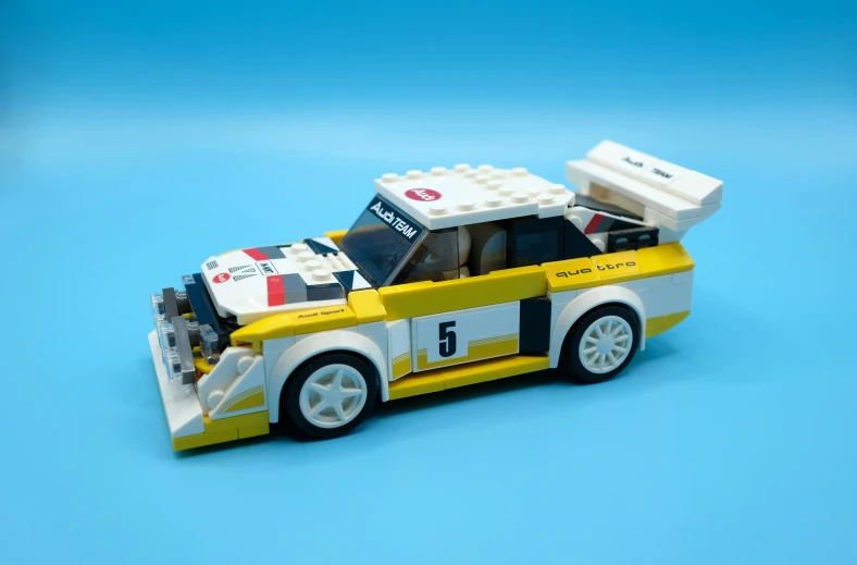lego model of a minivan with a yellow and white body