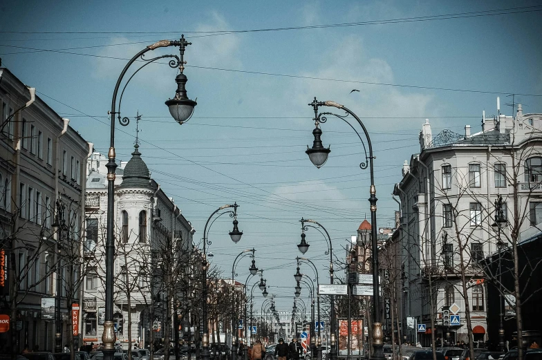 street lights are lined up on the side of a road