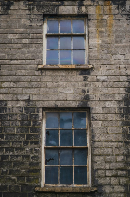 two windows with bars that are missing each others