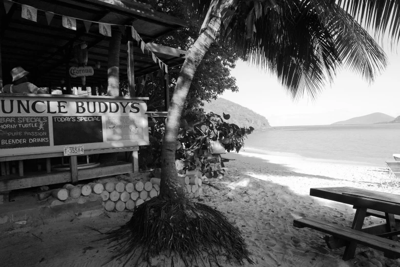 the small boat is sitting near the beach