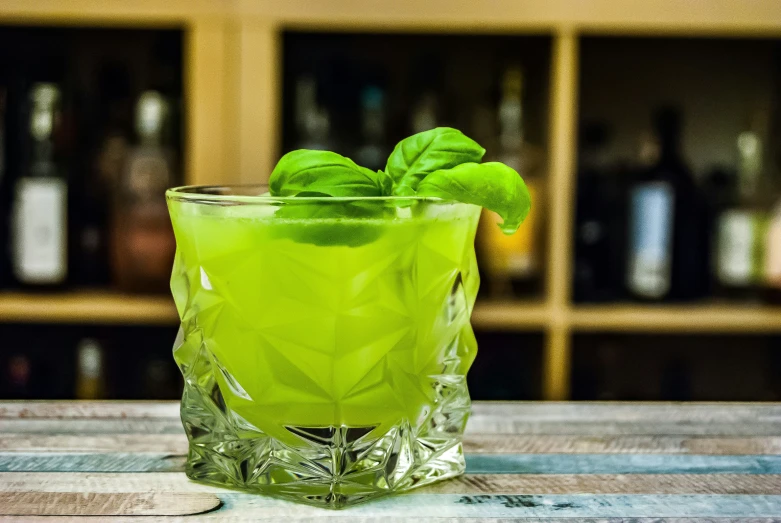 a close up of a drink in a glass on a table