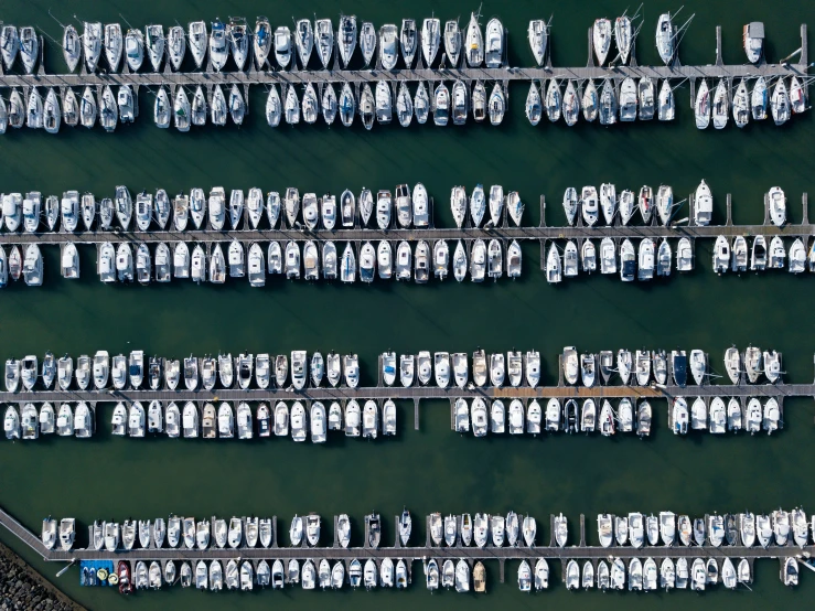 a aerial po of boats docked in an open bay