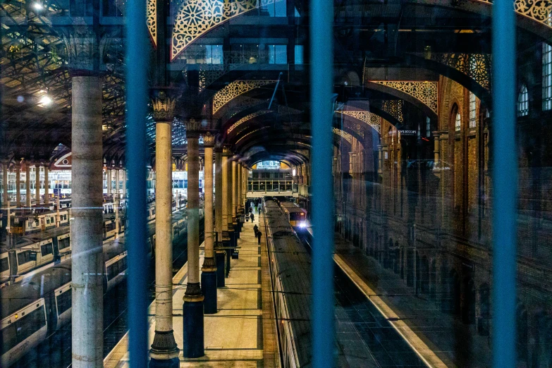 a subway is running parallel to other subway platforms