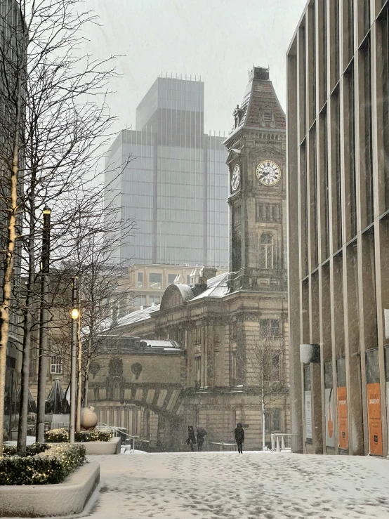 a clock on a large building in the city