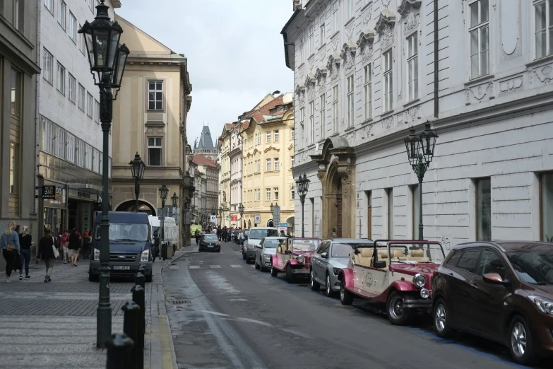 street with cars and people walking in the distance