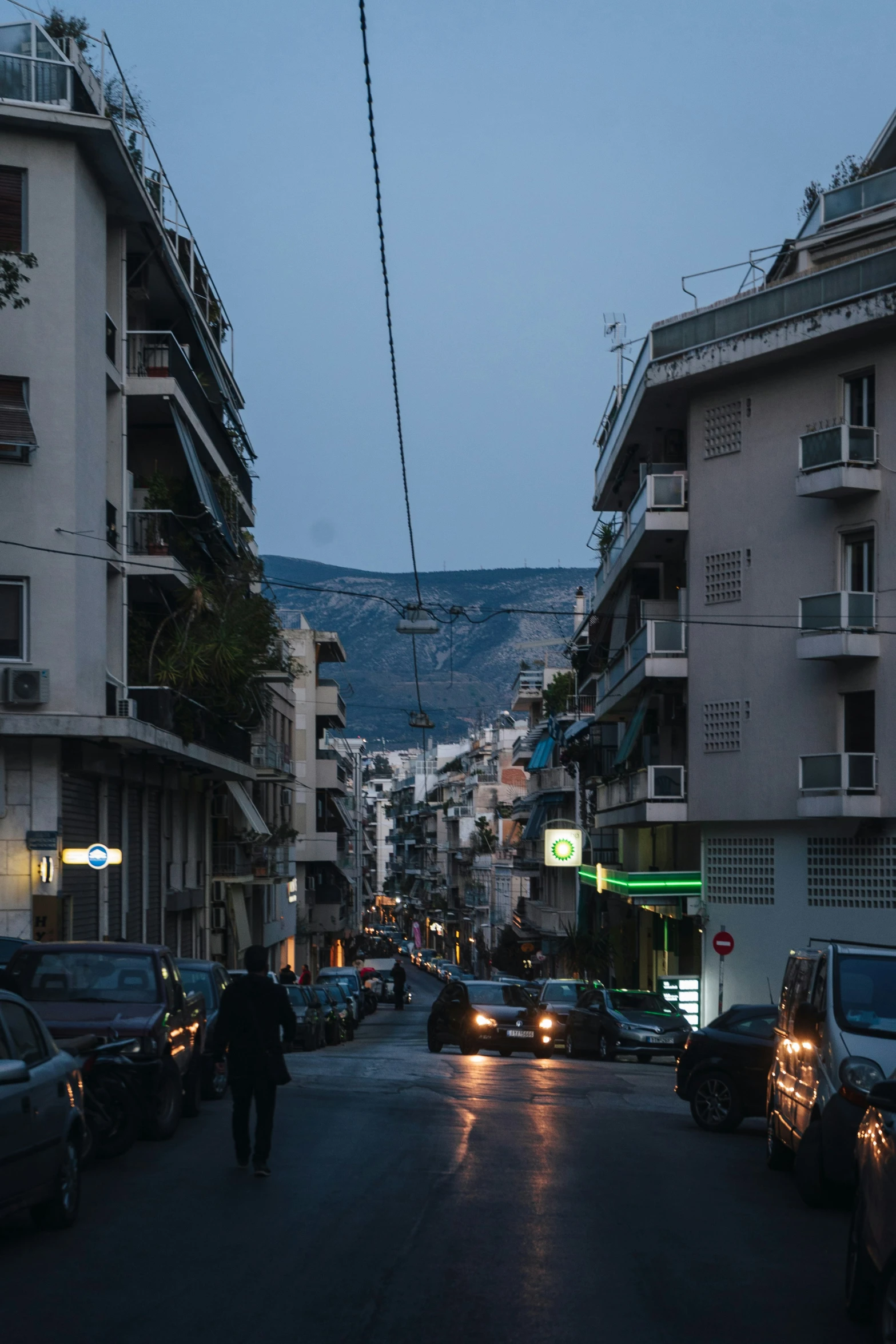 a city street with some cars parked on it